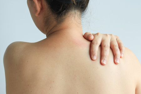 Female hand massaging shoulder or office syndrome, health conceptの写真素材
