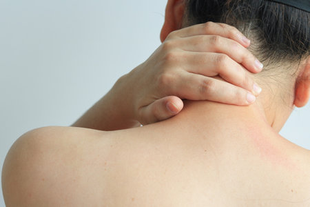 Female hand massaging shoulder or office syndrome, health conceptの写真素材
