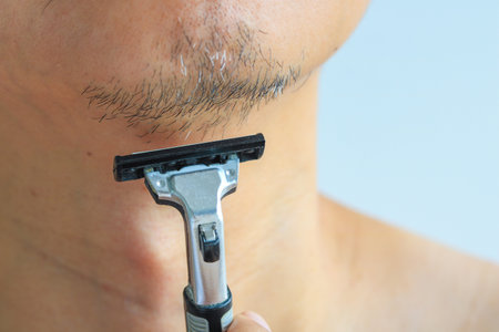 Man holding a regular razor, Health conceptの写真素材