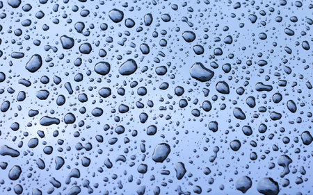 Dimension of rainy season water droplets on glassの写真素材