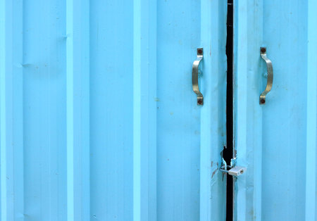 Blue Steel Door and Locked with Steel Key. Blue Steel Door with Handle and Locked with Steel Keyの写真素材