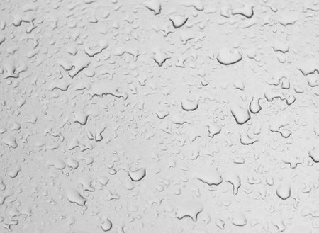 Water droplets in rainy season. Dimension of rainy season water droplets on glassの写真素材
