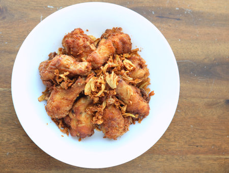 Golden brown fried chicken drumsticksの写真素材