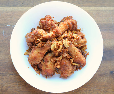 Golden brown fried chicken drumsticksの写真素材
