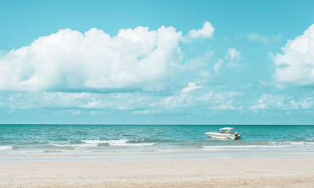 Anchored motor boat and blue sky backgroundの写真素材