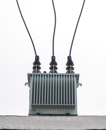 Three phase transformer on concrete platform on white background