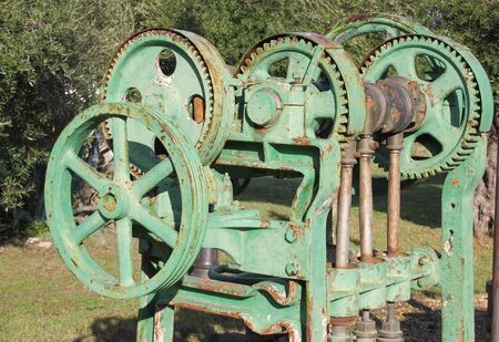 Old farm machinery used for pressing grapes in the manufacture of wineの写真素材