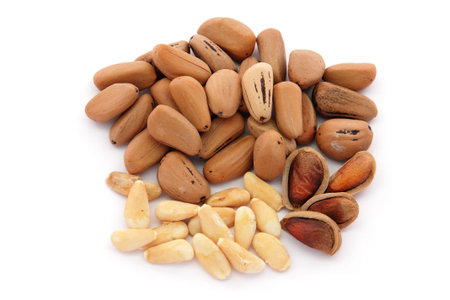 Dried pineapple with pine nuts on a white backgroundの写真素材