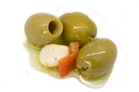marinated olives with olive oil, garlic and bell pepperの写真素材