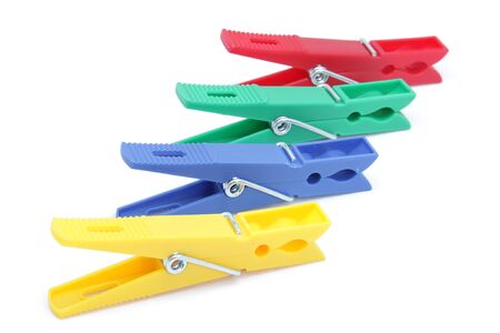 Clothes pegs of different colors used for domesticの写真素材