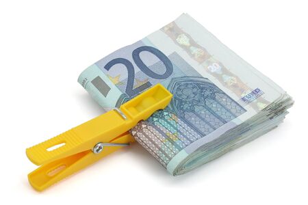 wad of twenty euros on a white backgroundの写真素材