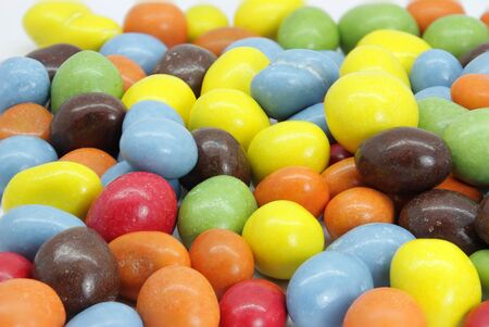coated peanuts and chocolate candy in different colorsの写真素材