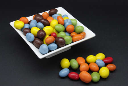 coated peanuts and chocolate candy in different colorsの写真素材