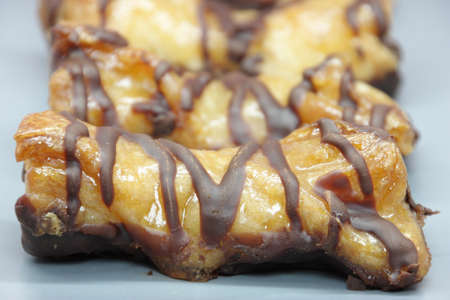 Cakes made with a loop pastry and chocolate dippedの写真素材