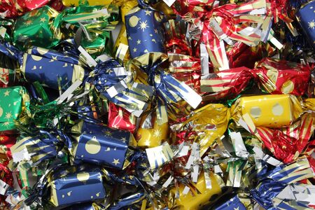 pure chocolate bonbons and milk chocolate wrapped in colored paperの写真素材