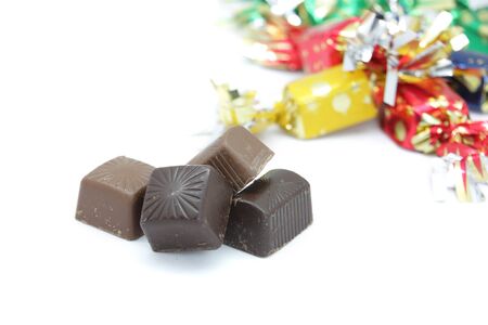 pure chocolate bonbons and milk chocolate wrapped in colored paperの写真素材