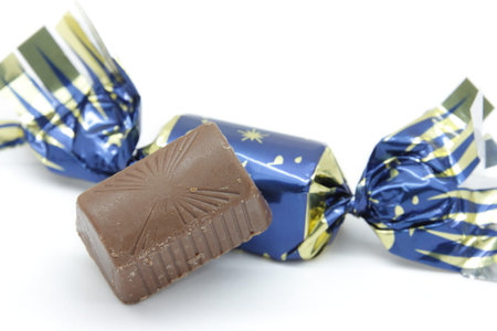 pure chocolate bonbons and milk chocolate wrapped in colored paper