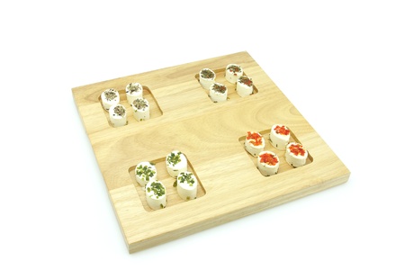 Appetizer consisting of small portions of fresh artisan cheeses flavored with spices.の写真素材