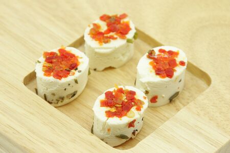Appetizer consisting of small portions of fresh artisan cheeses flavored with spices.の写真素材