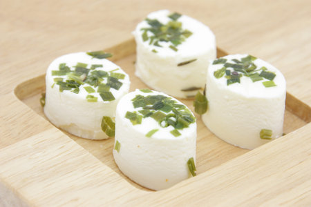 Appetizer consisting of small portions of fresh artisan cheeses flavored with spices.