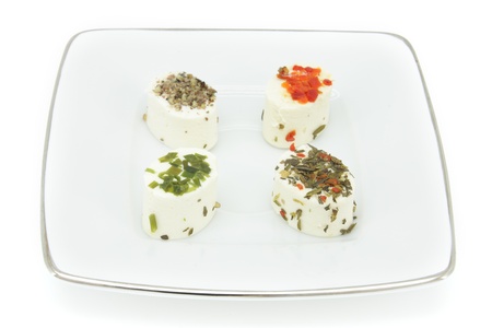 Appetizer consisting of small portions of fresh artisan cheeses flavored with spices.の写真素材