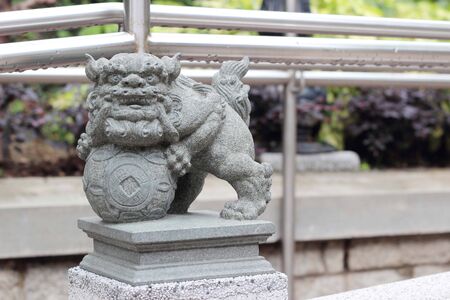 Ancient statue of Lion in Wong Tai Sin Templeの写真素材
