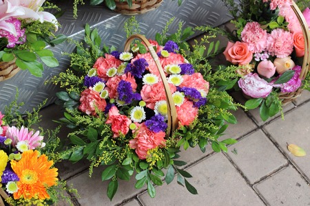 Bouquet of flowers in basketの写真素材