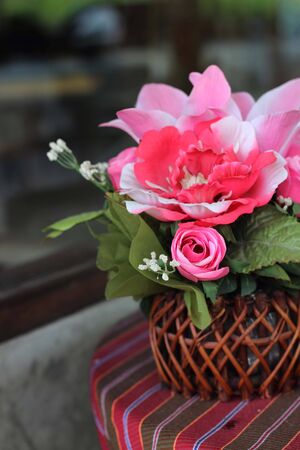 basket of peonies isolated on white backgroundの写真素材