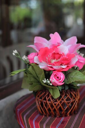 basket of peonies isolated on white backgroundの写真素材