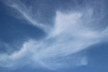 blue sky background with tiny cloudsの写真素材