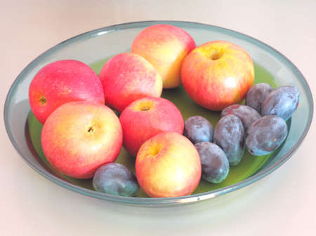 Apples and plumsの写真素材