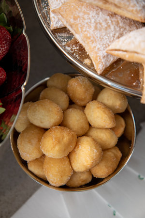 Close-up of a plate of homemade croquettes and strawberriesの写真素材