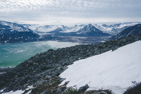View of the snow-capped mountains. Mount Aykuaivenchorr, Kirovsk, Murmansk Region, Russia.の写真素材
