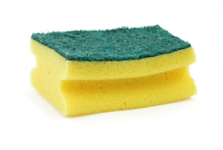 Isolated dish washing sponge on a white background.の写真素材