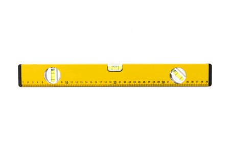 Yellow level tool isolated on a white background.