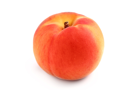 Nectarine or peach fruit isolated over a white background.の写真素材