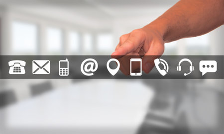 Man hand selects a set of contact icons by internetの写真素材