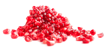 heap of pomegranate seeds isolated on white backgroundの写真素材