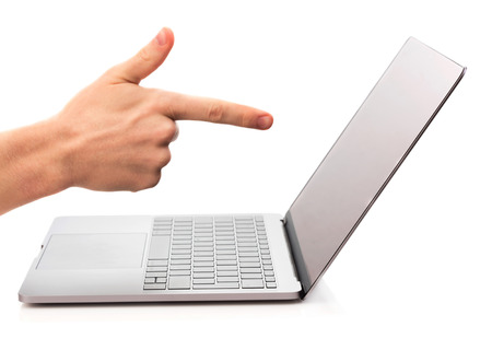 modern laptop with men's hand is pointing on screenの写真素材