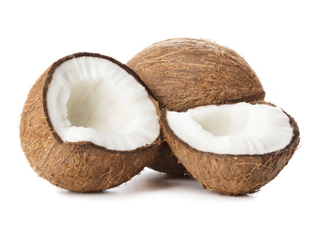 one solid and two cracked half of coconuts isolated on white backgroundの写真素材