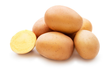 Heap of fresh raw potato isolated on white backgroundの写真素材