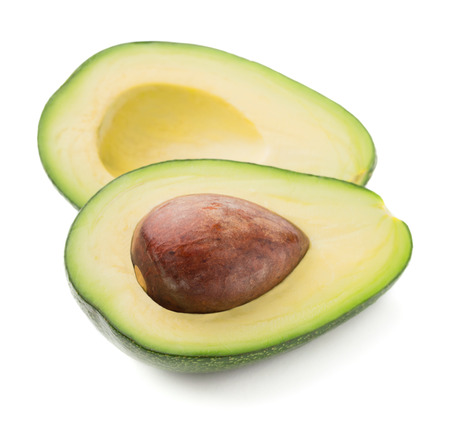 single ripe cut avocado isolated on white backgroundの写真素材