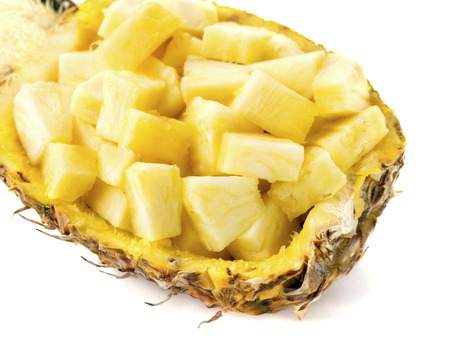 half of chopped pineapple isolated on white backgroundの写真素材