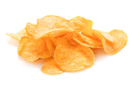 heap of potato chips isolated on white backgroundの写真素材