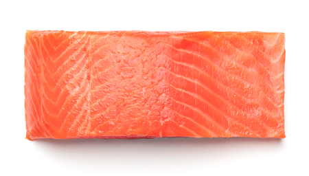 big piece of smoked salmon fillet isolated on white backgroundの写真素材