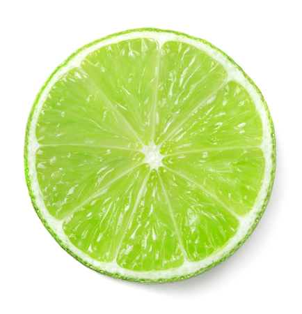 single slice of ripe green lime isolated on white backgroundの写真素材