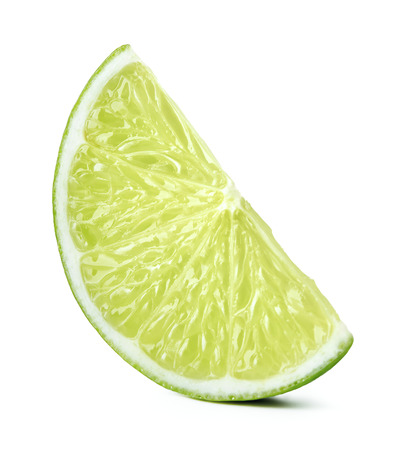 sliced ripe green lime fruit isolated on white backgroundの写真素材