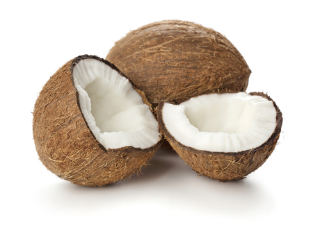 halves of cracked coconut isolated on white backgroundの写真素材