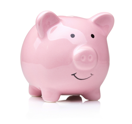 single ceramic pink piggy bank isolated on white backgroundの写真素材