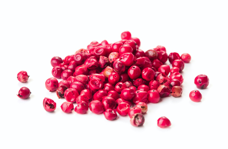 heap of pink peppercorn isolated on white backgroundの写真素材